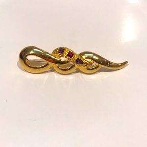 Golden pin brooch